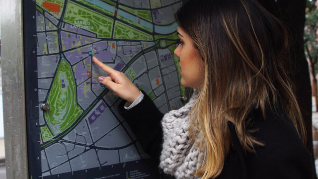 Woman Studying a City Map