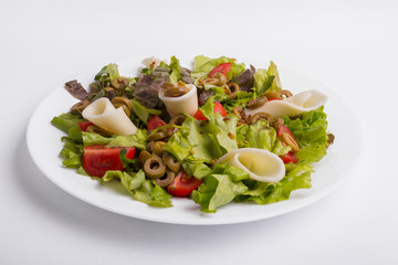 Italian vegetable salad on a white