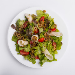 Italian vegetable salad on a white