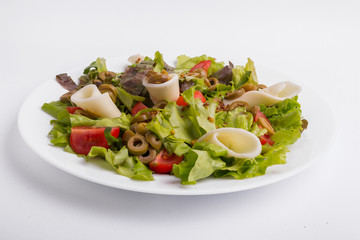 Italian vegetable salad on a white