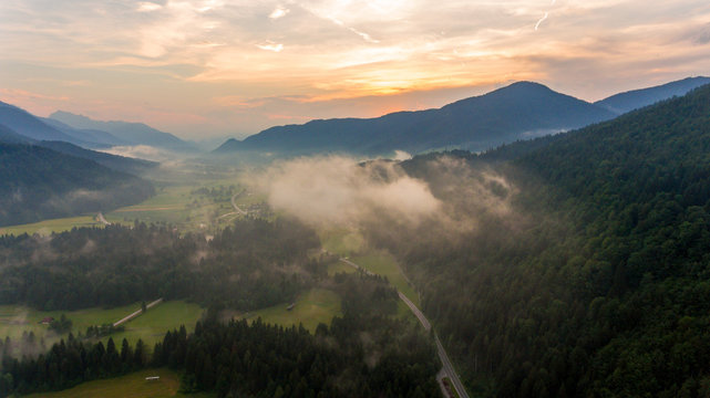 Aerial view of sunrise over a valley.