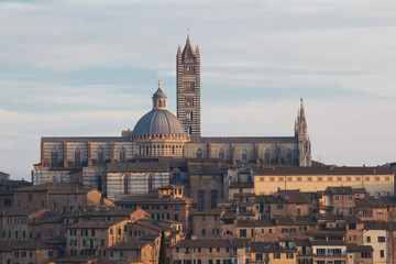 Fototapeta na wymiar View of Duomo di Siena or Metropolitan Cathedral of Santa Maria Assunta from north. Tuscany. Italy.