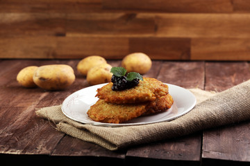 Potato pancake with cow berry sauce, selective focus