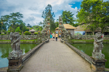 People walking inside of the temple of Mengwi Empire located in Mengwi, Badung regency that is famous places of interest in Bali, Indonesia