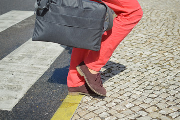 Woman walking zebra crossing outdoors background. Safe commuting sidewalk travel ransportation