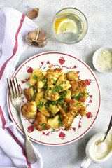 Roasted cauliflower with spicy sauce.Top view.