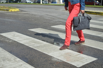 Woman walking zebra crossing outdoors background. Safe commuting sidewalk travel ransportation