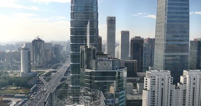 4k,timelapse,Aerial View of heavy traffic through BeiJing central business district that is located in the Chaoyang district,the main hub for financial and business activities in China's capital city.