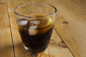 Cola with lemon and ice