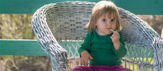 Messy caucasian girl with lollipop