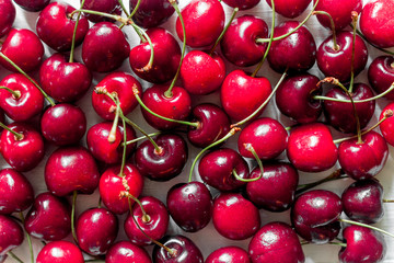 Fruit concept. Vivid cherry background top view