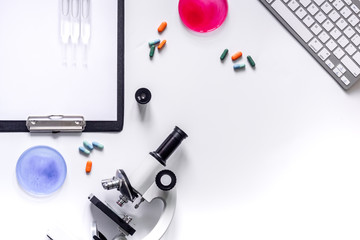 Tools for medical tests microscope, Petri dish, ampoule on white background top view copyspace