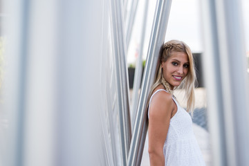 happy beautiful blonde woman smiling looking at the camera and posing