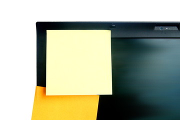 yellow and orange color post it paper stick on screen of laptop on white background have copy space...