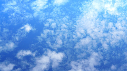 Fototapeta na wymiar Blue sky and little white clouds nature background