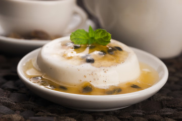 Panna cotta dessert with passion fruit and mint