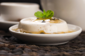 Panna cotta dessert with passion fruit and mint