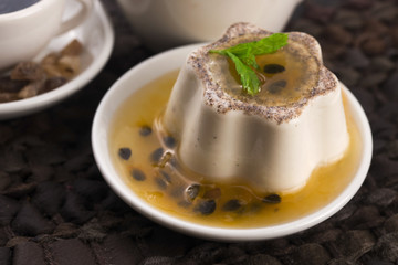 Panna cotta dessert with passion fruit and mint