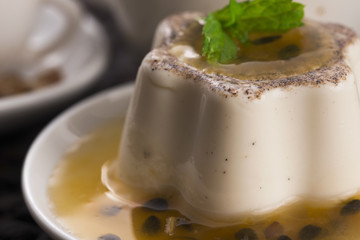 Panna cotta dessert with passion fruit and mint