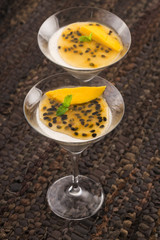 Panna cotta dessert with passion fruit and mint
