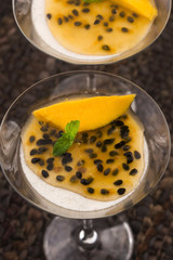 Panna cotta dessert with passion fruit and mint