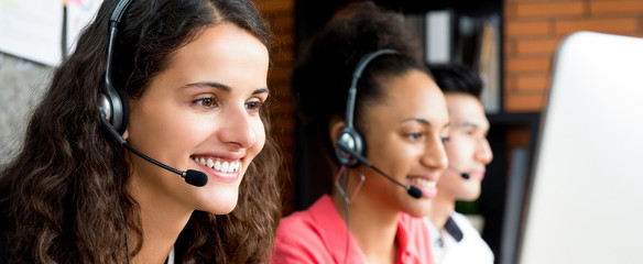 Group of multiethnic smiling call center team