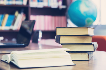 open book on the table in library