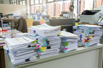 Pile of unfinished documents on office desk, Stack of business paper