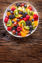 Fruit fresh mixed tropical fruit salad. Bowl of healthy fresh fruit salad - died and fitness concept.