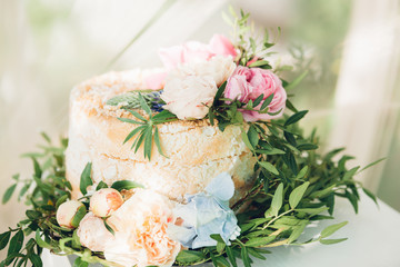 wedding cake decorated with fresh flowers
