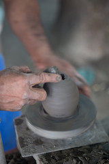 Fototapeta na wymiar Guaitil Artisnal Village, Costa Rica - April 18, 2016: A potter shows how he makes ceramics in Guaitil Artisanal Village, Costa Rica