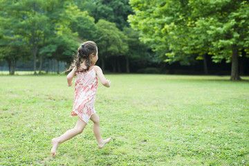 Happy Little Girl running barefoot