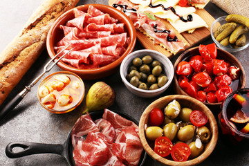 spanish tapas and sangria on wooden table - mediterran antipasti set