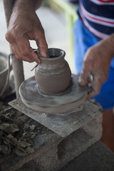 Fototapeta na wymiar Guaitil Artisnal Village, Costa Rica - April 18, 2016: A potter shows how he makes ceramics in Guaitil Artisanal Village, Costa Rica