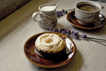 Morning moments of relaxation and relaxation with fresh coffee and dessert on a wooden background