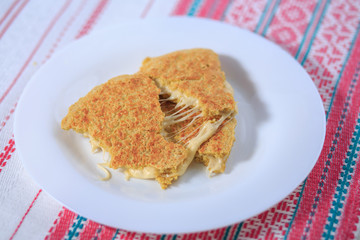 A henbane with cheese of a white нарелке of unaccented background