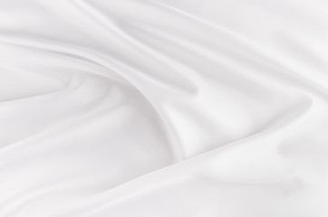 Fototapeta na wymiar White smooth elegant silk or satin fabric texture with liquid wave.