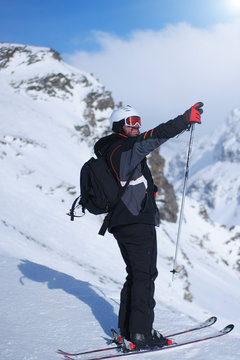 Skiing: male skier in powder snow. Italian Alps, Europe.