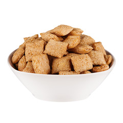 Golden pads corn flakes in white bowl isolated on white background. Cereals.