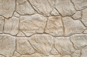 New decorative plaster imitating a stone wall