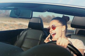 Relaxed happy woman traveling in a car