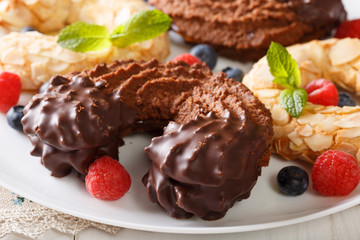 Shortbread cookie in the shape of a chocolate horseshoe close-up. horizontal