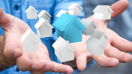 Businessman using 3D rendered small white and blue houses