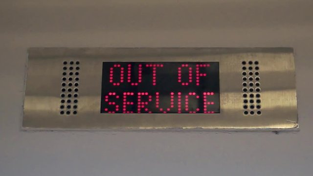 Blinking sign out-of-service on the display of an elevator