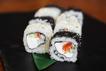 Delicious rolls with fish and cheese	