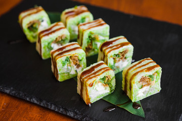 Delicious rolls with fish and cheese	