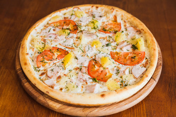 elicious pizza with meat, cheese and mushrooms