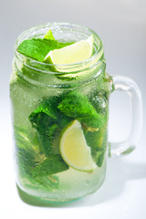 lemonade with lime and mint in mason jar