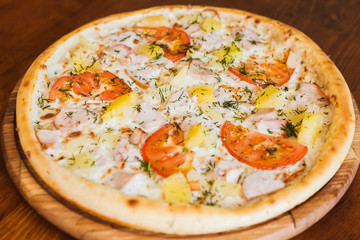 elicious pizza with meat, cheese and mushrooms