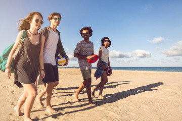 Group of smiling friends in sunglasses